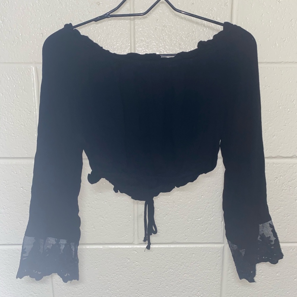 Black, off the shoulder, crop top, flared sleeves.